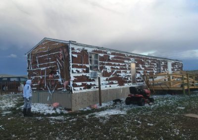 Hilfe Winterprojekt Lakota Indianer USA zerstoerte Haeuser